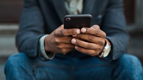 person typing on cell phone